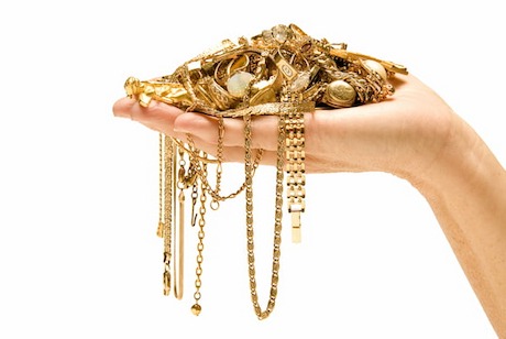 women hand with golden pieces