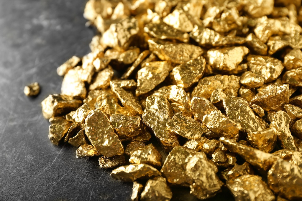 Many gold nuggets on table