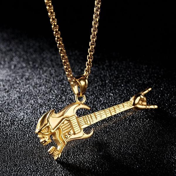 Pendentif Guitare Tête de mort – couleur Or – Guitare Attitude Pendentif Guitare Tête de mort - couleur Or - Guitare Attitude